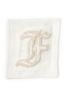 Letter F embroidered on linen